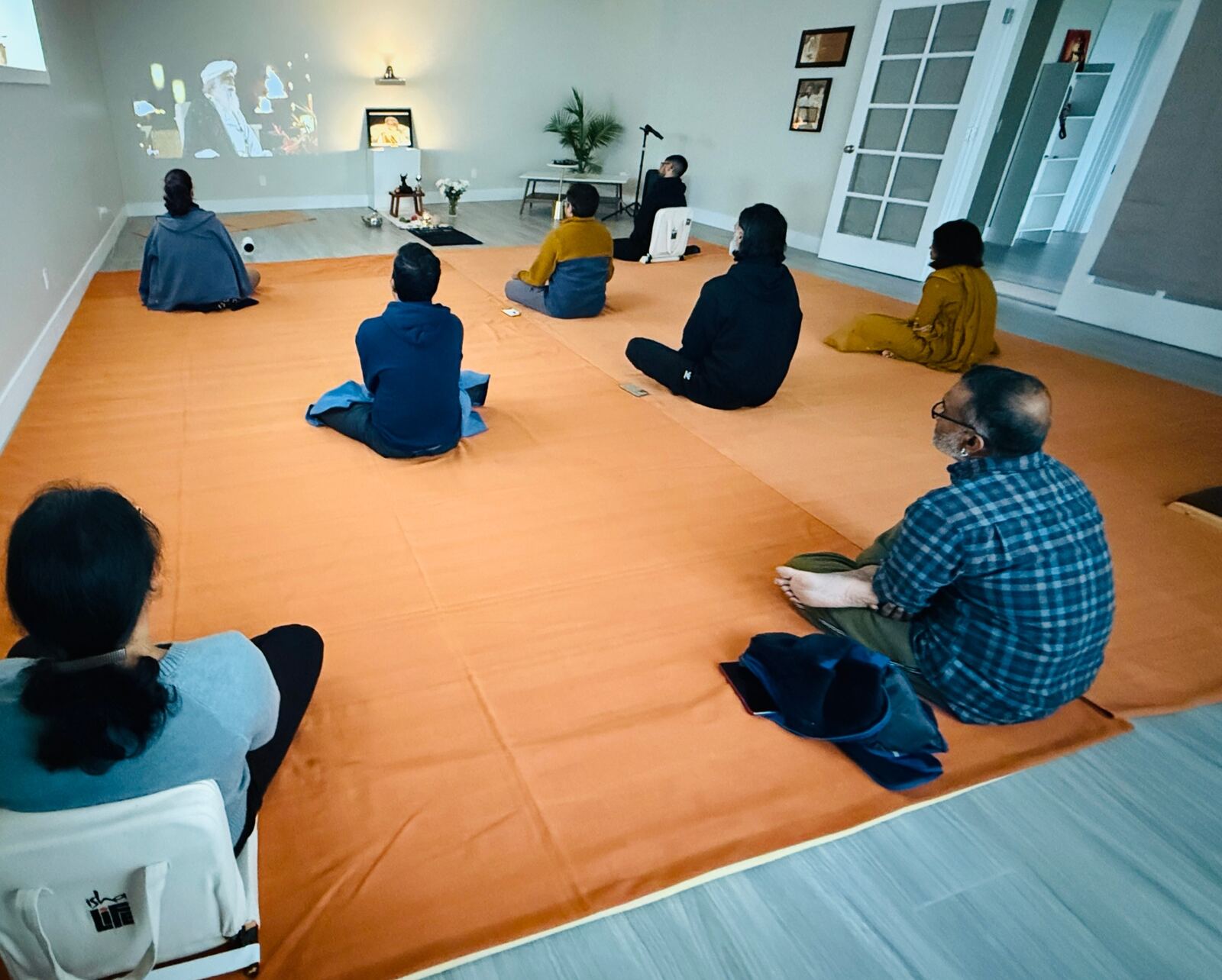 Community gathered for a group meditation session